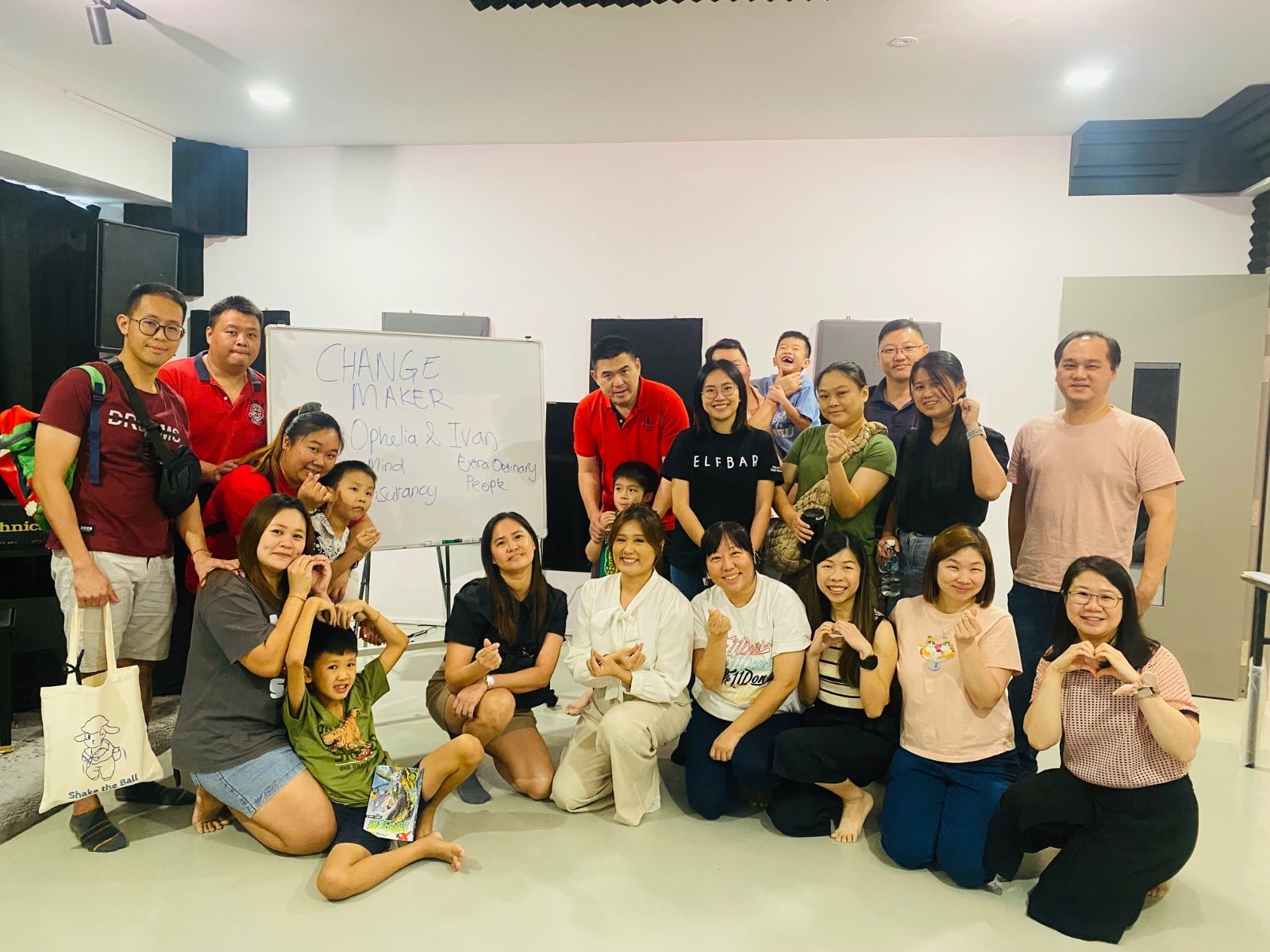 Ophelia and participants at a Change Maker workshop, families and children together after the session